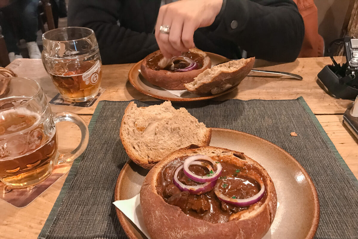 Goulash soup in bread in Prague