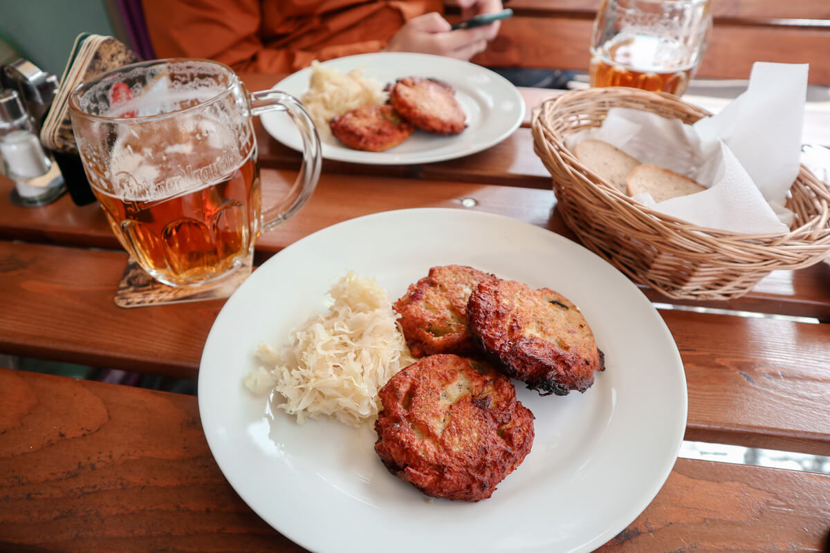 traditional food like potato fritters and sauerkraut in Prague